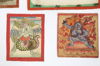 Lot 40 - TWELVE BUDDHIST DEVOTIONAL PAINTED ICONS AND AUSPICIOUS SYMBOLS