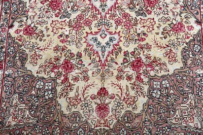 Lot 99 - AN ANTIQUE KIRMAN LAVER RUG, SOUTH PERSIA