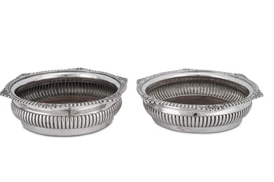Lot 516 - A pair of George III sterling silver wine coasters, London 1816 by William Stroud