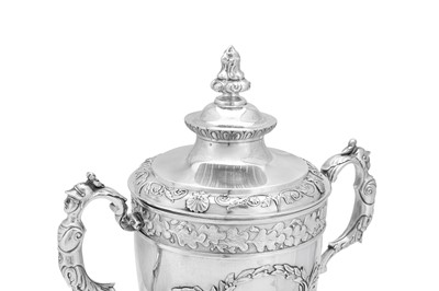 Lot 526 - A George III sterling silver twin handled cup and cover, London 1810 by William Frisbee (first reg. 12th April 1791)