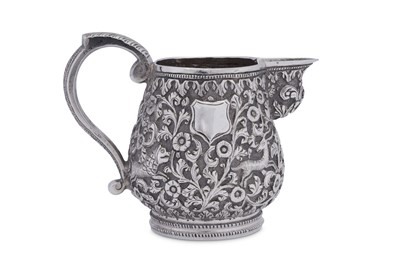 Lot 199 - A late 19th century Anglo – Indian unmarked silver cream or milk jug, Cutch circa 1880