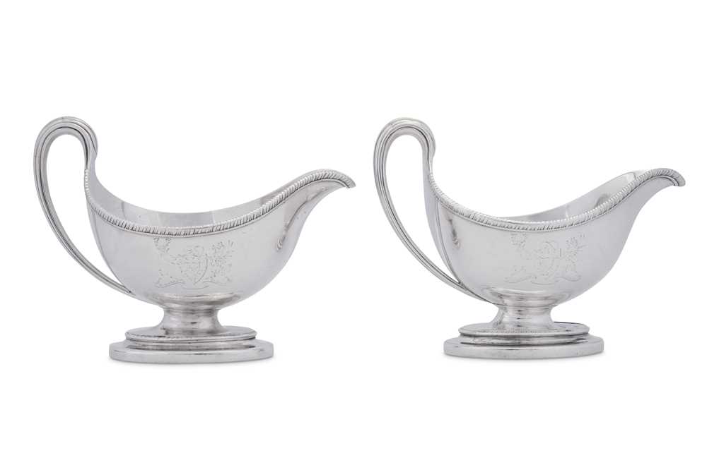 Lot 513 - Earl of Burlington - A pair of George III sterling silver sauceboats, London 1784 by Edward Wakelin and William Taylor (reg. 25th Sep 1776)