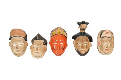 Lot 276 - A COLLECTION OF DECORATVE SOUTH EAST ASIAN HARDWOOD MASKS, 20TH CENTURY