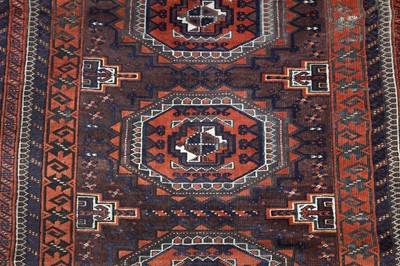 Lot 9 - AN ANTIQUE BALOUCH RUG, NORTH-EAST PERSIA