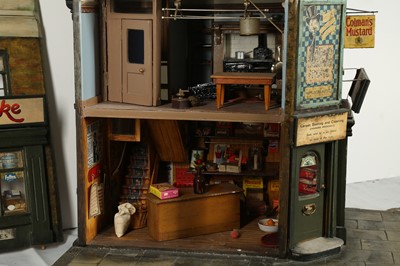 Lot 206 - MODELS: A LARGE SCRATCH BUILT MODEL OF A CORNER SHOP, 20TH CENTURY