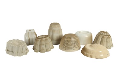 Lot 245 - KITCHENALIA: EIGHT WHITE POTTERY JELLY MOULDS, LATE 19TH/EARLY 20TH CENTURY