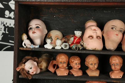 Lot 185 - DOLLS: A LARGE COLLECTION OF PLASTIC AND BISQUE DOLLS HEADS, 20TH CENTURY