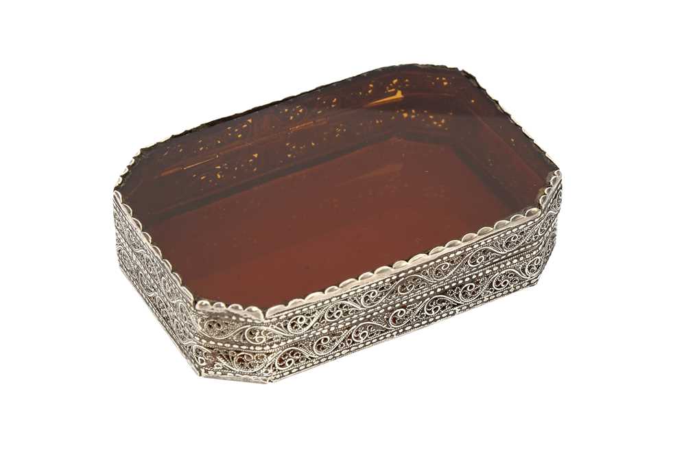 Lot 361 - AN INDO-PORTUGUESE AMBER GLASS AND SILVER FILIGREE BOX