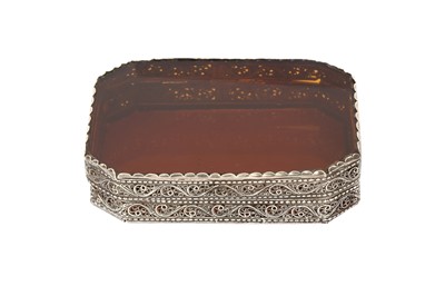 Lot 361 - AN INDO-PORTUGUESE AMBER GLASS AND SILVER FILIGREE BOX