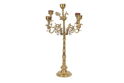 Lot 367 - A FOUR-PRONGED BRASS CANDLESTICK WITH BIRDS