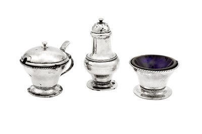 Lot 499 - An Edwardian ‘Arts and Crafts’ sterling silver three-piece cruet, Birmingham 1905 by Liberty and Co