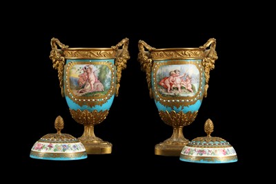 Lot 52 - A PAIR OF 19TH CENTURY FRENCH SEVRES STYLE PORCELAIN AND ORMOLU MOUNTED URNS AND COVERS
