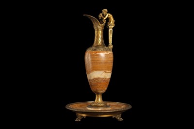 Lot 100 - A 19TH CENTURY FRENCH BANDED ONYX AND ORMOLU MOUNTED EWER ON STAND