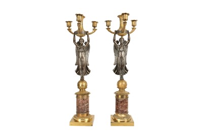 Lot 68 - A PAIR OF 19TH CENTURY FRENCH EMPIRE STYLE GILT AND PATINATED BRONZE CANDELABRA