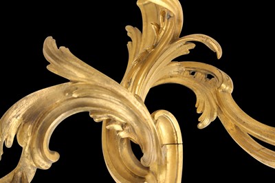 Lot 106 - A PAIR OF 19TH CENTURY FRENCH GILT BRONZE ROCOCO STYLE THREE LIGHT WALL APPLIQUES