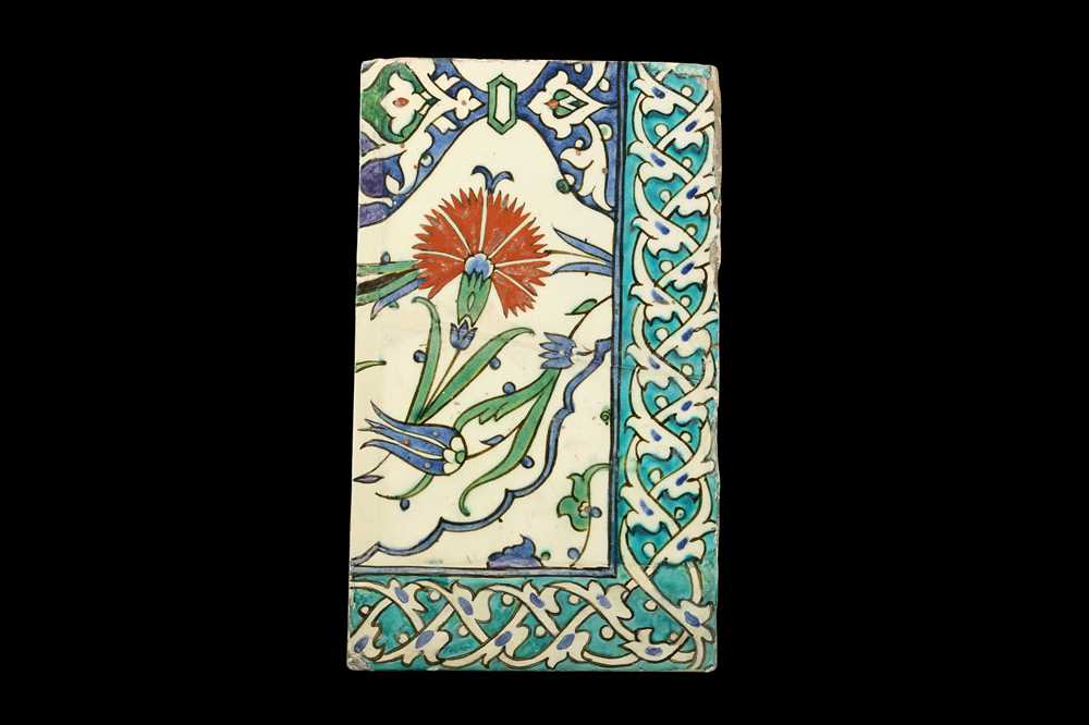 Lot 231 - A 16TH CENTURY TURKISH GLAZED POTTERY IZNIK TILE