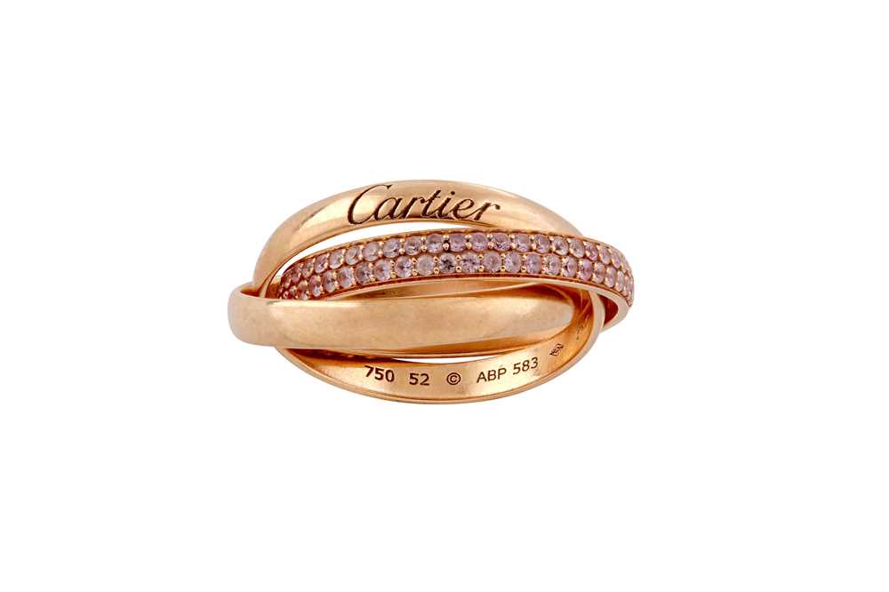 Lot 13 - Cartier | A rose gold and pink sapphire  'Trinity' ring, 2015