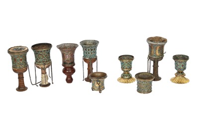 Lot 308 - A COLLECTION OF NINE GILT COPPER QALYAN CUPS