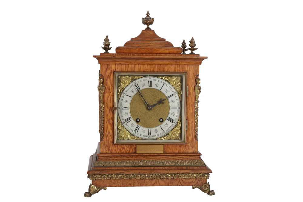 Lot 121 - A LATE VICTORIAN OAK AND BRASS MOUNTED MANTEL CLOCK