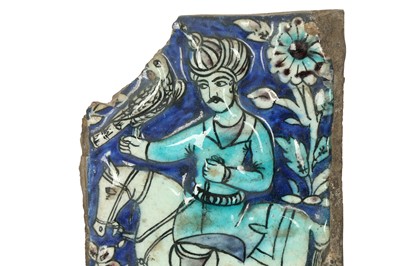 Lot 508 - A FRAGMENTARY MOULDED QAJAR POTTERY TILE