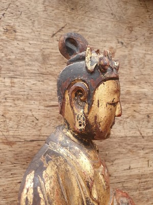 Lot 14 - A CHINESE GILT-LACQUER WOOD FIGURE OF AN ATTENDANT.