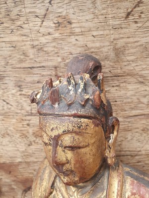 Lot 14 - A CHINESE GILT-LACQUER WOOD FIGURE OF AN ATTENDANT.