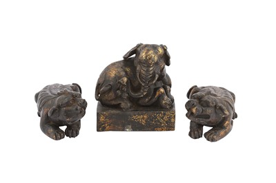Lot 693 - A PAIR OF CHINESE GILT-BRONZE 'QILIN' SCROLL WEIGHTS AND A GILT-BRONZE 'ELEPHANT' SEAL.