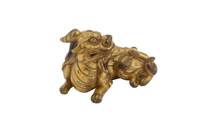 Lot 649 - A CHINESE GILT-BRONZE 'QILIN' PAPERWEIGHT.