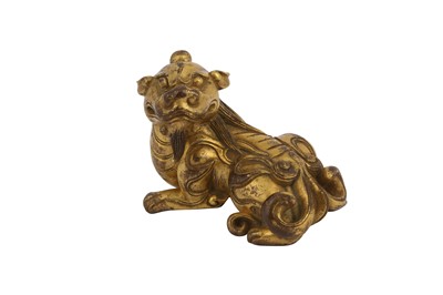 Lot 649 - A CHINESE GILT-BRONZE 'QILIN' PAPERWEIGHT.