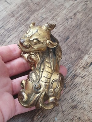 Lot 649 - A CHINESE GILT-BRONZE 'QILIN' PAPERWEIGHT.