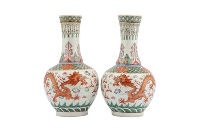 Lot 27 - A PAIR OF CHINESE FAMILLE ROSE 'DRAGON' BOTTLE VASES.