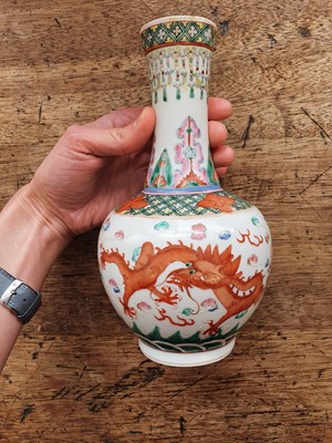 Lot 27 - A PAIR OF CHINESE FAMILLE ROSE 'DRAGON' BOTTLE VASES.