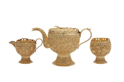 Lot 148 - An early 20th century Anglo - Indian unmarked silver gilt three-piece tea service, Kashmir circa 1900