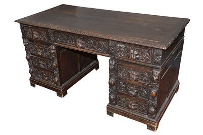Lot 175 - A VICTORIAN PROFUSELY CARVED STAINED OAK PEDESTAL DESK