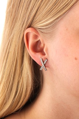 Lot 104 - A pair of diamond earrings