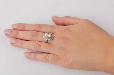 Lot 10 - A cultured pearl and diamond dress ring