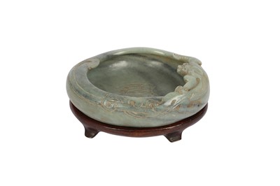 Lot 588 - A CHINESE CELADON JADE 'CHILONG' WASHER.