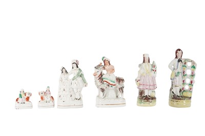 Lot 14 - A PAIR OF MINIATURE STAFFORDSHIRE POTTERY FIGURES OF CHILDREN WITH SPANIELS, LATE 19TH CENTURY