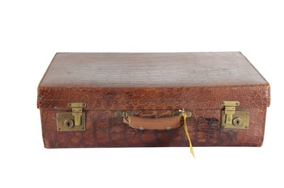 Lot 970 - A PRESSED LEATHER FAUX CROCODILE SKIN SUITCASE, EARLY 20TH CENTURY