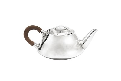Lot 504 - A George V 'Arts and Crafts' sterling silver bachelor teapot, Birmingham 1912 by Liberty and Co