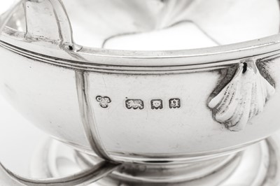 Lot 570 - A George V Art Deco sterling silver three-piece tea service, London 1931 by Charles Boyton