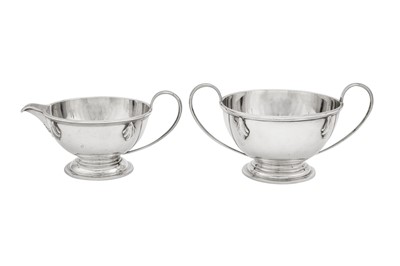 Lot 570 - A George V Art Deco sterling silver three-piece tea service, London 1931 by Charles Boyton