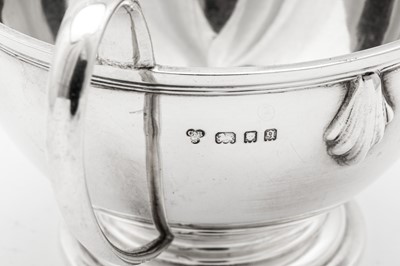 Lot 570 - A George V Art Deco sterling silver three-piece tea service, London 1931 by Charles Boyton