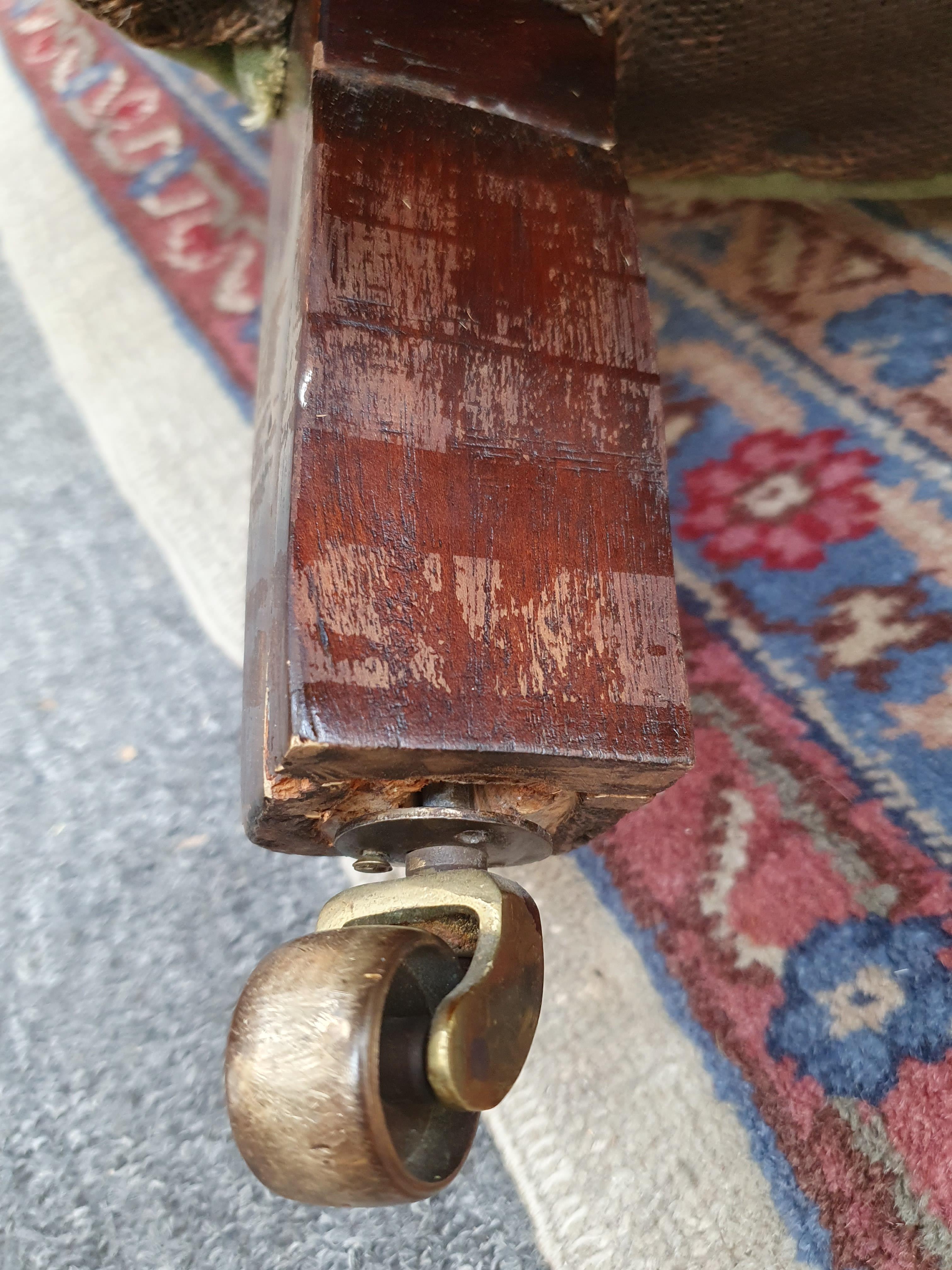 Lot 185 A VICTORIAN TUB CHAIR ON CASTORS