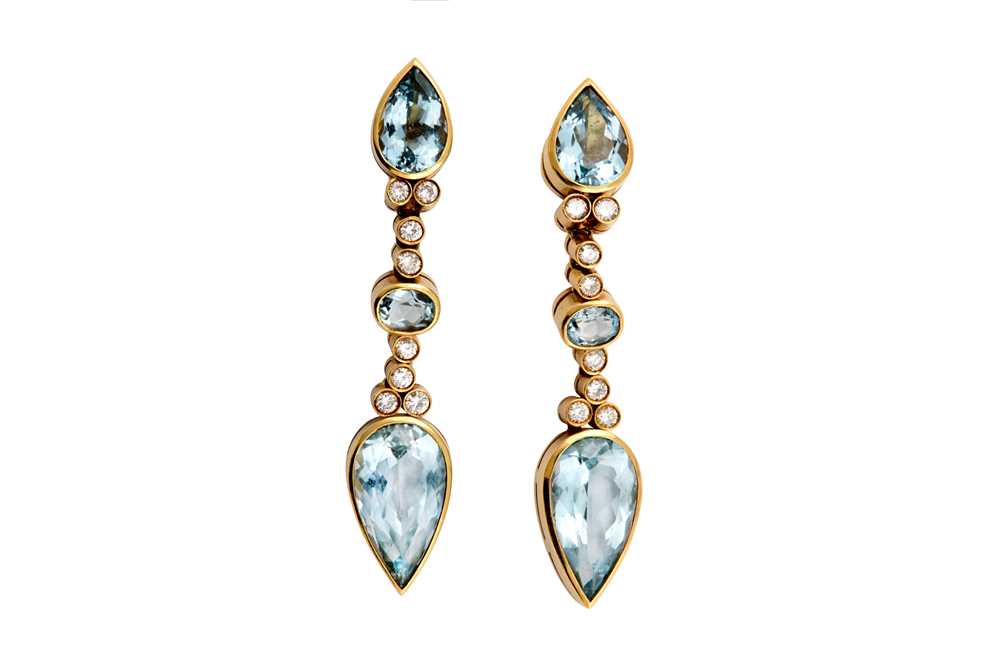 Lot 42 - A pair of blue topaz and diamond pendent earrings