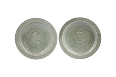 Lot 173 - A PAIR OF CHINESE LONGQUAN CELADON 'FISH' DISHES.