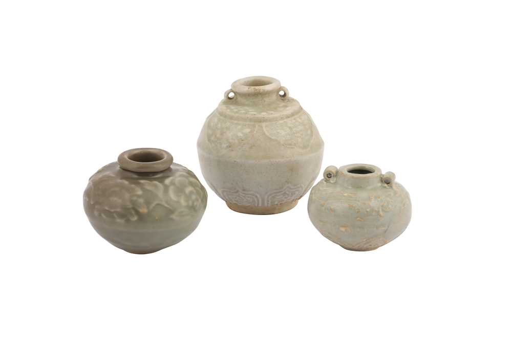 Lot 231 - THREE CELADON GLAZED JARLETS.