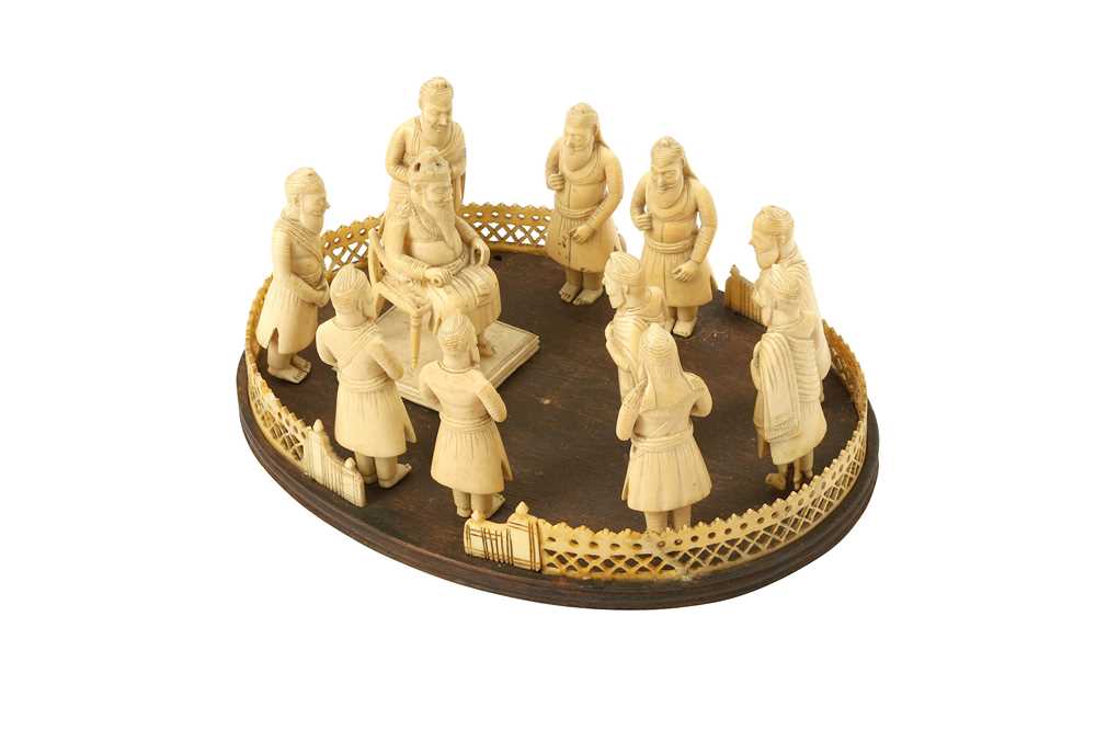 Lot 412 - λ ELEVEN CARVED IVORY FIGURES OF THE FIRST