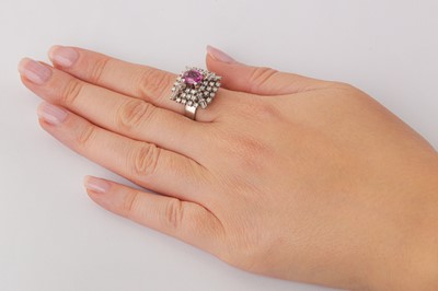 Lot 123 - A pink sapphire and diamond dress ring