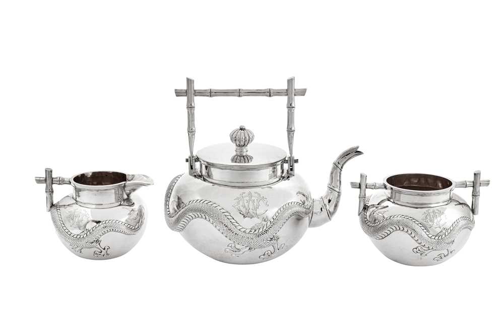 Lot 248 - An early 20th century Chinese Export silver three-piece tea service, Canton circa 1900 retailed by Wang Hing